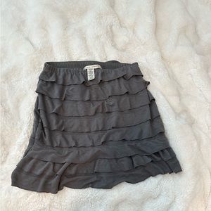 Gray max studio skirt with ruffles, never been worn, size small.